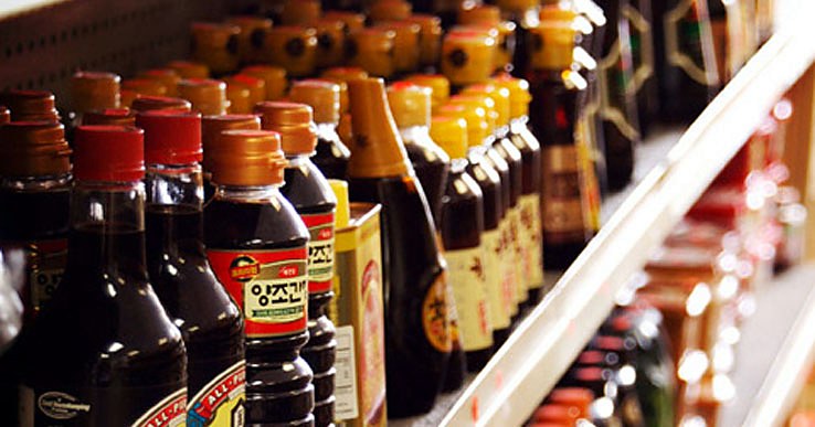 Rows of soy sauce bottles on the shelf